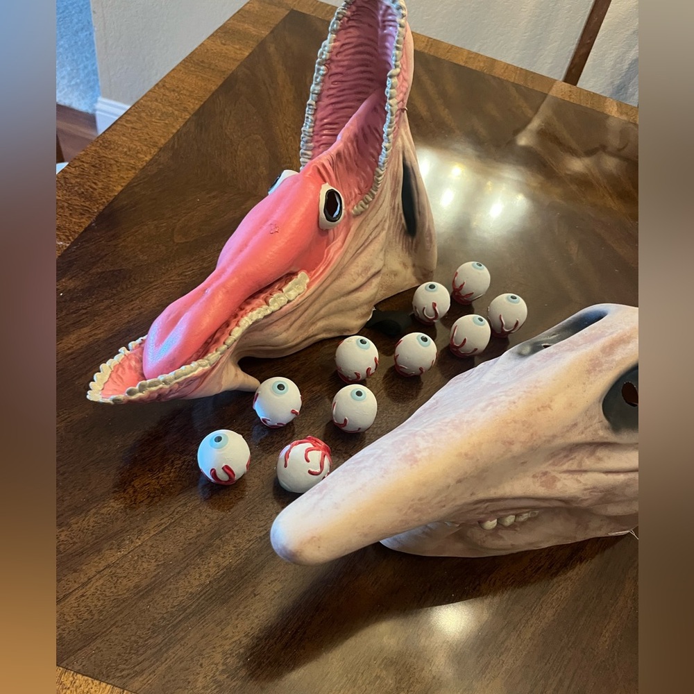 Beetlejuice Adam and Barbara masks w/ eyeballs for fingers.